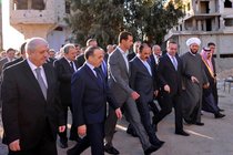 His Grip Still Secure, Bashar al-Assad Smiles as Syria Burns