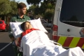 A woman is taken to hospital after the attack at Hawthorn station on Thursday.