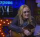 Melissa Etheridge singing Fixer Blues about the Brangelina break-up. Kelly Clarkson held up the lyrics for the ...