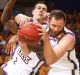 Scramble: Anthony Petrie of the Bullets competes for a rebound at Qudos Bank Arena.