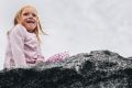 Adeline Priest, 6, of Ngunnawal atop the Moruya tonalite boulder.