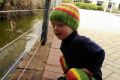 Curious koi photo-bombs little Lior at St John of God Hospital in Bunbury.