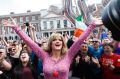 Rory O'Neill, known by the Drag persona Panti, celebrates with yes supporters at Dublin Castle after the result of ...