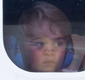 VICTORIA, BC - OCTOBER 01:  Prince George of Cambridge looks out of the window of a sea plane as he departs Victoria on ...