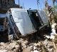 A car stands on its side after being blown away by winds brought by Hurricane Matthew in Jeremie, Haiti.