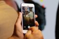 A reporter looks over the new Google Pixel phone following a product event, Tuesday, Oct. 4, 2016, in San Francisco. The ...