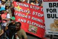 Activists march to the Convention on International Trade in Endangered Species of Wild Fauna and Flora, (CITES) in ...