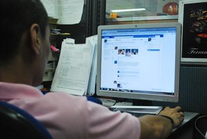 File - A filipino man seen browsing the internet looking at Facebook in Makati City, Philippines, July 18 , 2011.