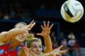 Gabi Simpson of the Queensland Firebirds competes for the ball with Kimberlee Green of the NSW Swifts during the 2016 ...