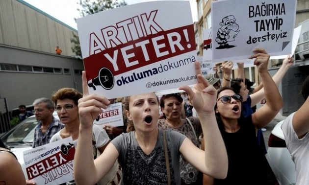 Protestors march with placards reading 'Enough! Don't turn our schools into Imam Hatips' in Istanbul this summer. Photo: AFP