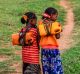 Ethiopian girls, like many in Africa, often walk long distances to bring back jugs of water.