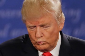 Donald Trump listens to Hillary Clinton during the second presidential debate at Washington University in St. Louis on ...