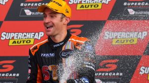 Corker: Will Davison of Tekno Autosports Holden celebrates on the podium after winning the Bathurst 1000 at Mount Panorama.