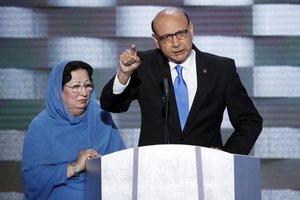 Khizr Khan, father of fallen US Army Capt. Humayun S. M. Khan speaks as his wife Ghazala listens during the final day of the Democratic National Convention in Philadelphia , Thursday, July 28, 2016.