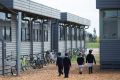 Some of the 60  portable classrooms used at the booming Alamanda College. 
