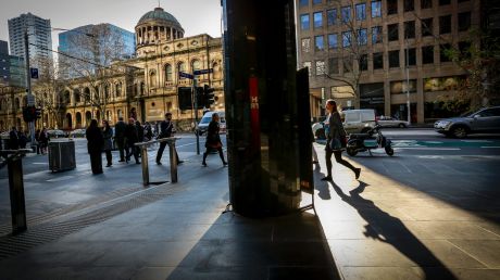 Modern Melbourne #185 8:42am on Williams Street, Melbourne. Commuters on their way to work. Sunday Age. Photo: Eddie Jim.