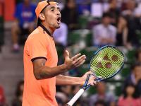 Australia's Nick Kyrgios reacts after losing a poi