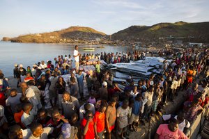 Residents line up for food after Hurricane Matthew in Anse D'Hainault, Haiti, Tuesday, Oct. 11, 2016.