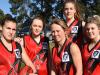 Women’s team trains under car headlights