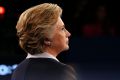 Hillary Clinton calmly watches as Republican presidential nominee Donald Trump speaks.