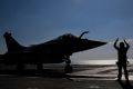 A Rafale jet fighter leaves France's flagship Charles de Gaulle aircraft carrier to join the US-led coalition against IS.