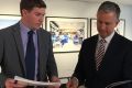 The Liberals' deputy leader Alistair Coe and leader Jeremy Hanson examine the audit report into the Land Development ...