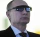 Russian President Vladimir Putin wears special glasses at a research facility in St Petersburg