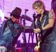 It's going to be more expensive to see artists such as Axl Rose, left, and Duff McKagan of Guns N' Roses, who are ...