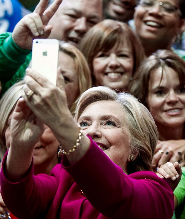 Democratic presidential candidate Hillary Clinton takes a selfie with supporters at a campaign rally at the Zembo Shrine ...