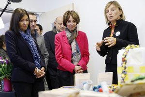 Mayor of Paris Anne Hidalgo, left, and French Health Minister Marisol Touraine listen to Doctor Elisabeth Avril, right, director of the Gaia association for prevention and care in addiction and substance abuse, in the first safe- injection room for drug addicts in Paris, Tuesday, Oct. 11, 2016.