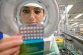 A Bayer Schering Pharma employee examines YAZ birth control pills.