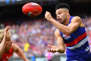 Jason Johannisen on his way to the Norm Smith Medal.