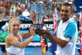 Holding on tight: Daria Gavrilova and Nick Kyrgios with the Hopman Cup.