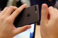 Michael Horowitz, from Chicago, checks out his new iPhone 7 Plus at the Apple Store on Michigan Avenue, Friday, Sept. ...