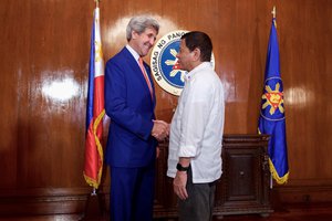 U.S. Secretary of State John Kerry shakes hands with Philippines President Rodrigo Duterte