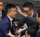 Lawmaker Raymond Chan Chi-chuen tries to break through the security guards during the election of president of the ...