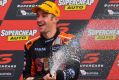 Corker: Will Davison of Tekno Autosports Holden celebrates on the podium after winning the Bathurst 1000 at Mount Panorama.