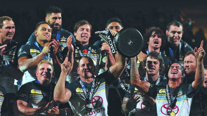 LEEDS, ENGLAND - FEBRUARY 21: Johnathan Thurston and Matthew Scott of North Queensland Cowboys lift the World Club Series trophy after victory over Leeds Rhinos in the World Club Series match between Leeds Rhinos and North Queensland Cowboys at Headingley on February 21, 2016 in Leeds, England. (Photo by Alex Livesey/Getty Images)