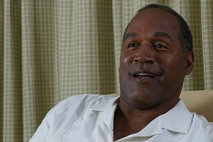  O.J. Simpson speaks during an interview Friday, June 4, 2004 in Miami. Simpson talked about his life after Nicole, their children he has raised alone and how he copes with those who believe he&acute;s guilty. (AP Photo/Wilfredo Lee) ** SPECIAL RATES APPL