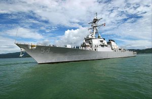 The US Navy (USN) Arleigh Burke Class Guided Missile Destroyer USS CURTIS WILBUR (DDG 54) drops anchor at the Vietnamese port of Da Nang