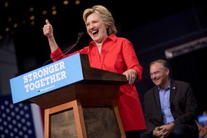 Democratic presidential candidate Hillary Clinton, accompanied by Democratic vice presidential candidate Sen. Tim Kaine, D-Va., gives a thumbs up while speaking at a rally at David L. Lawrence Convention in Pittsburgh, Saturday, July 30, 2016.