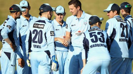 Spearhead: Josh Hazlewood celebrates with teammates after taking the wicket of Ben Cutting of the Bulls.