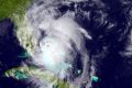 A satellite image from the National Oceanic and Atmospheric Administration shows Hurricane Matthew moving along the east ...