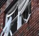 A blown-out window of a Bondi Junction apartment block that was evacuated on Friday morning following an explosion.