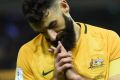 Saved a point: Mile Jedinak scored Australia's only goal against Japan. 