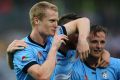 Silence is golden: Matt Simon gestures towards Central Coast fans after scoring against his old club last year.