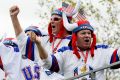 US fans cheer during a practice round for the Ryder Cup at Hazeltine National Golf Club.