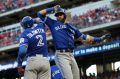 Solid start: Troy Tulowitzki and Jose Bautista celebrate the latter's home run.