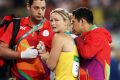 Mickle is assisted by medical staff after dislocating her shoulder at the Rio Olympics.