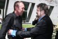 Fairfax photographer Andrew Meares with Senator Derryn Hinch after he moved a motion to amend photography rules in the ...